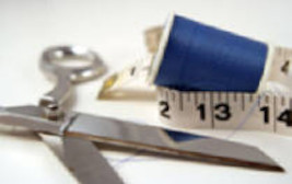 Cropped photo of scissors and measuring tape.