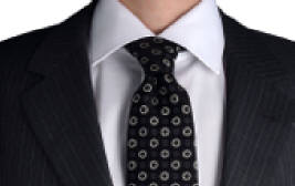 Cropped photo of a man wearing a shirt and tie.