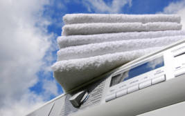 Photo of towels on a washing machine.